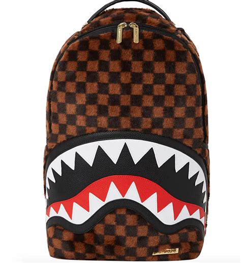 carpet shark sprayground backpack.